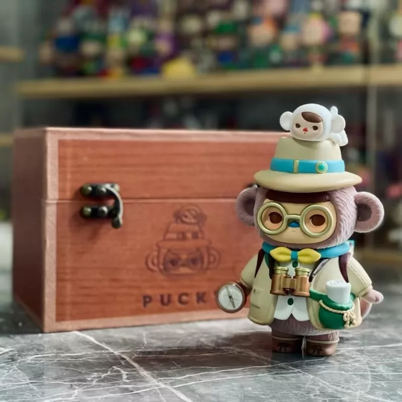Figura de bebé arqueólogo mono PUCKY Edición limitada