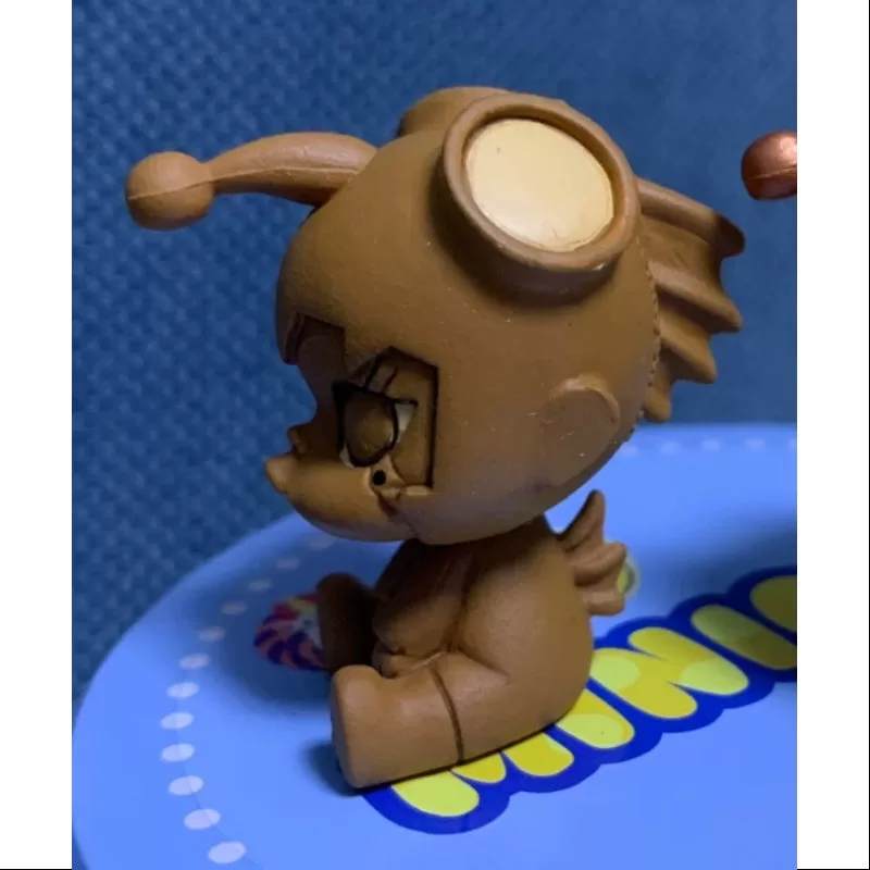 MOLLY Bebé Molly Serie 1 Pequeño Pez Niño Chocolate