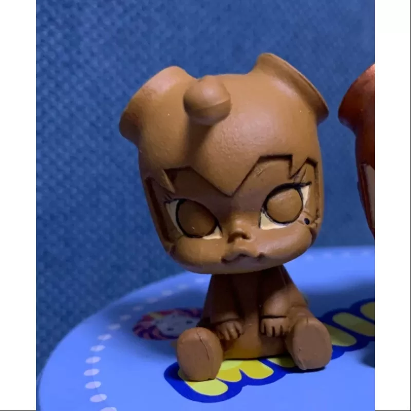 MOLLY Bebé Molly Serie 1 Pequeño Pez Niño Chocolate